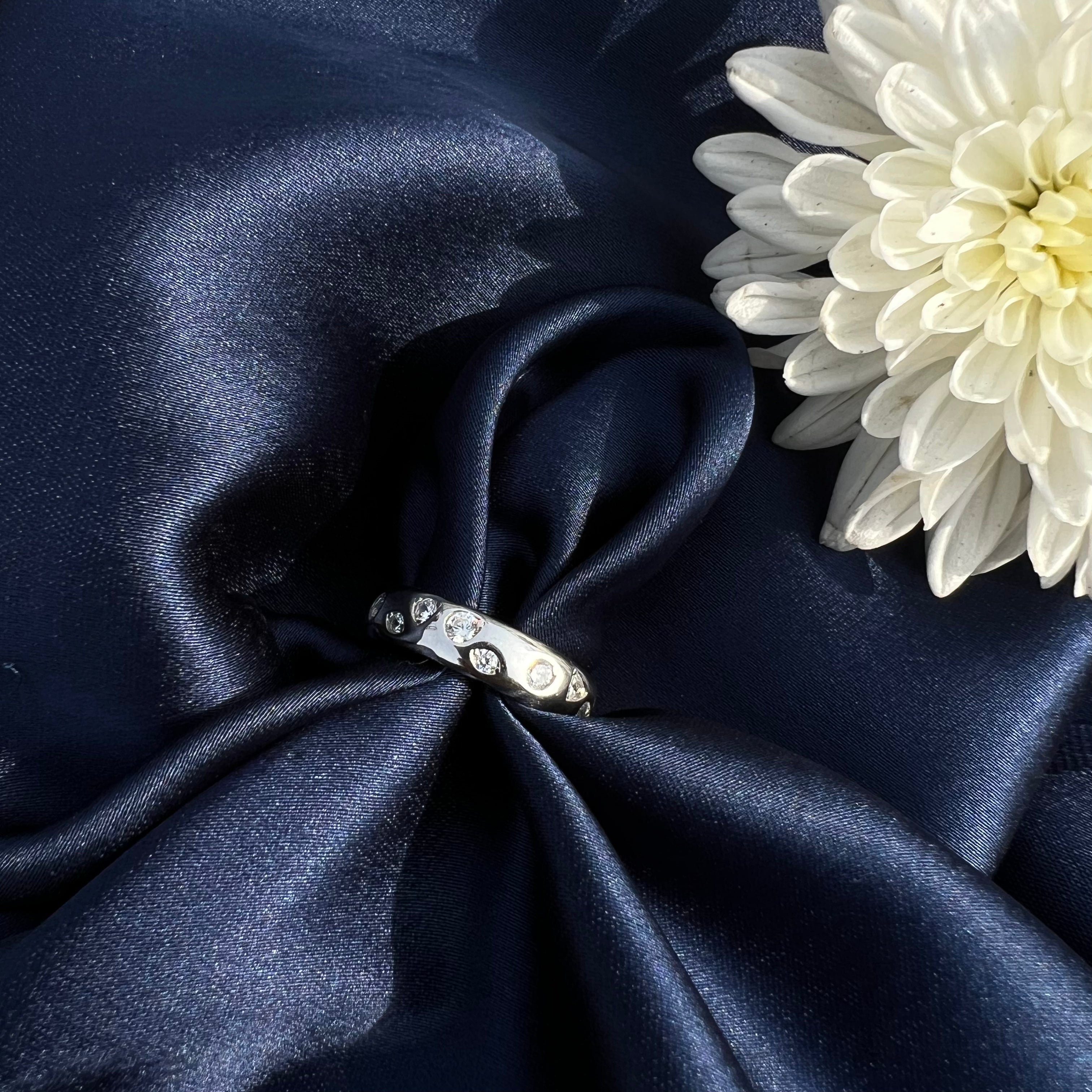 Silver ring with small diamonds