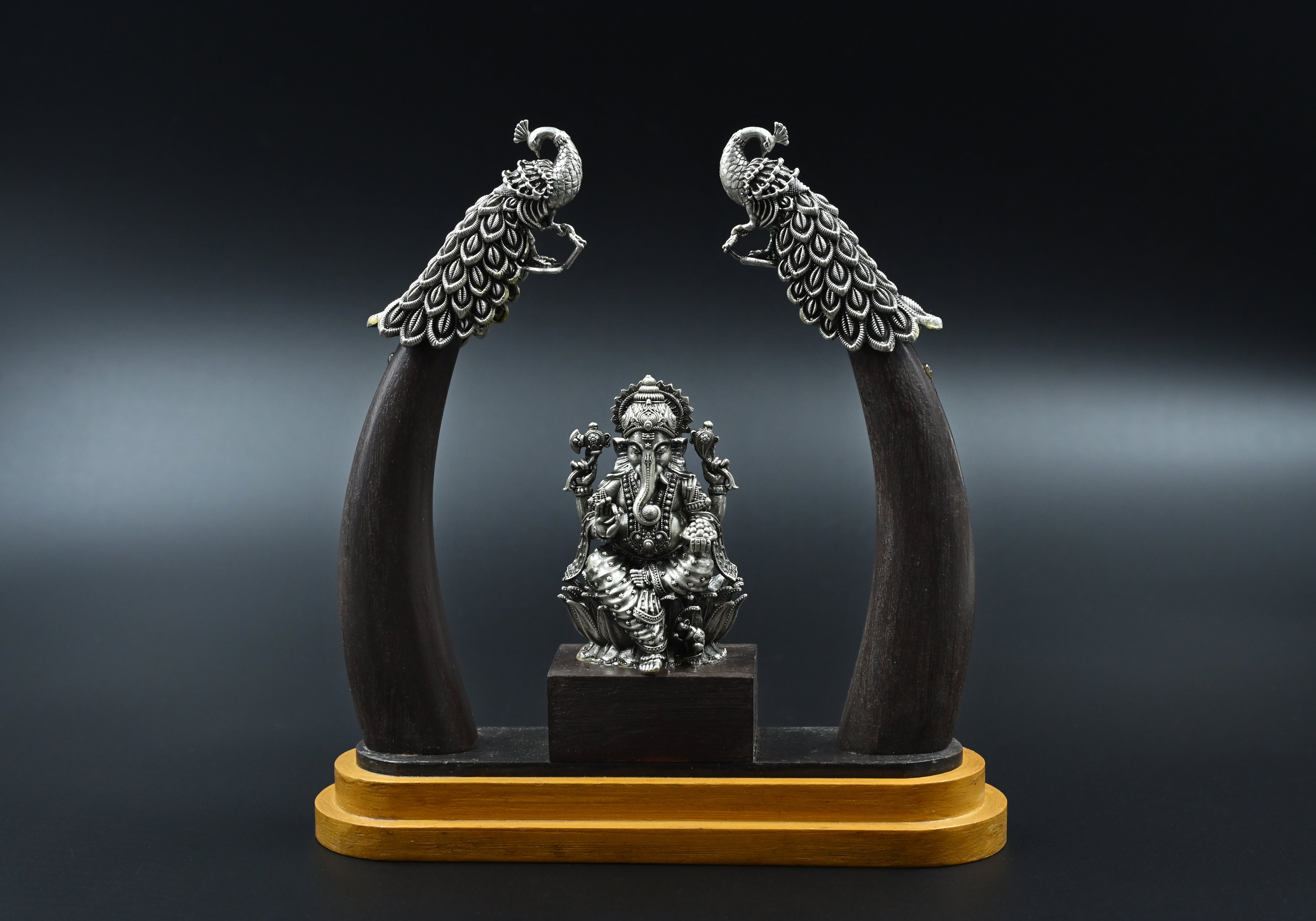 Silver Ganpati on wooden base
