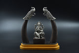 Silver Ganpati on wooden base