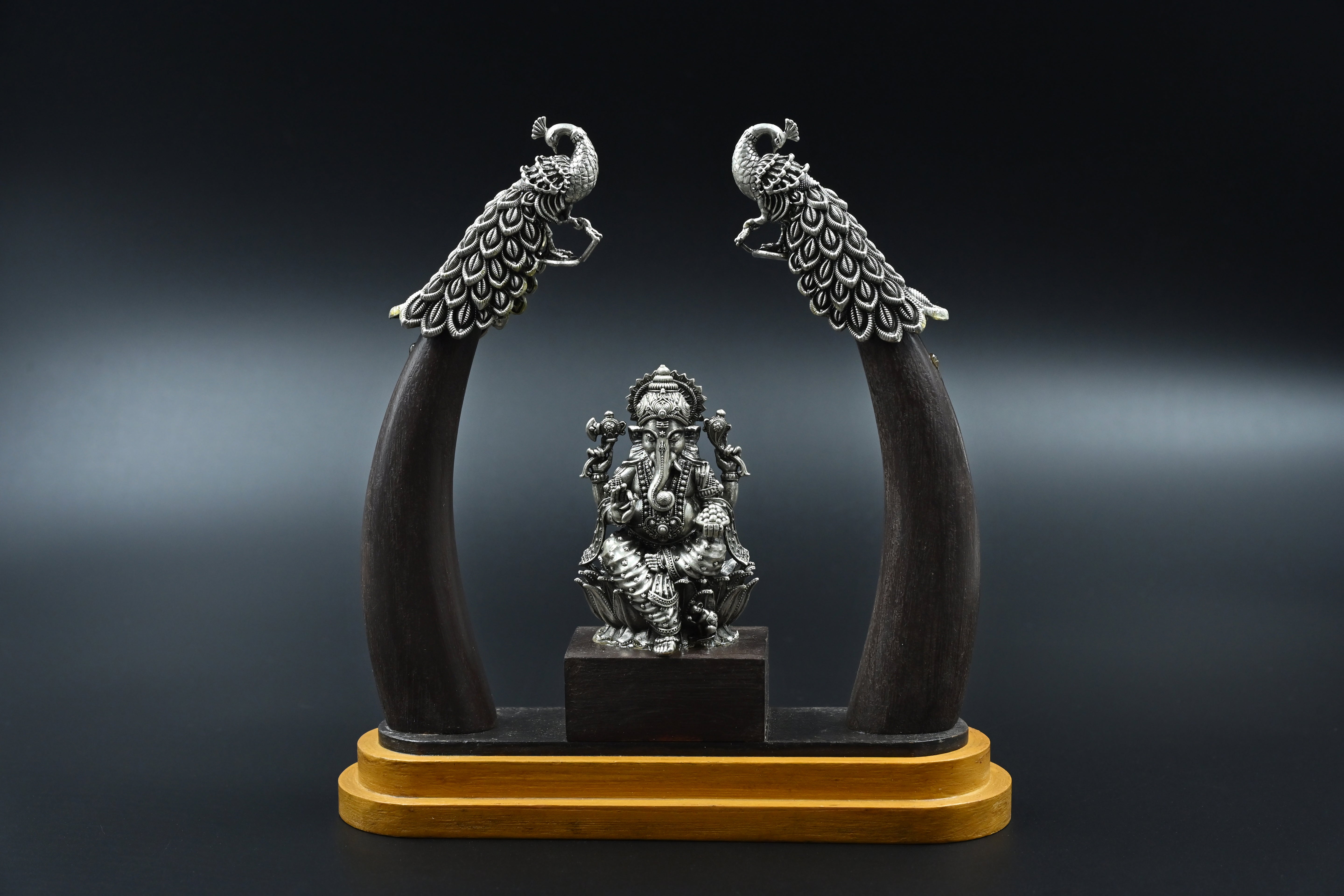 Silver Ganpati on wooden base
