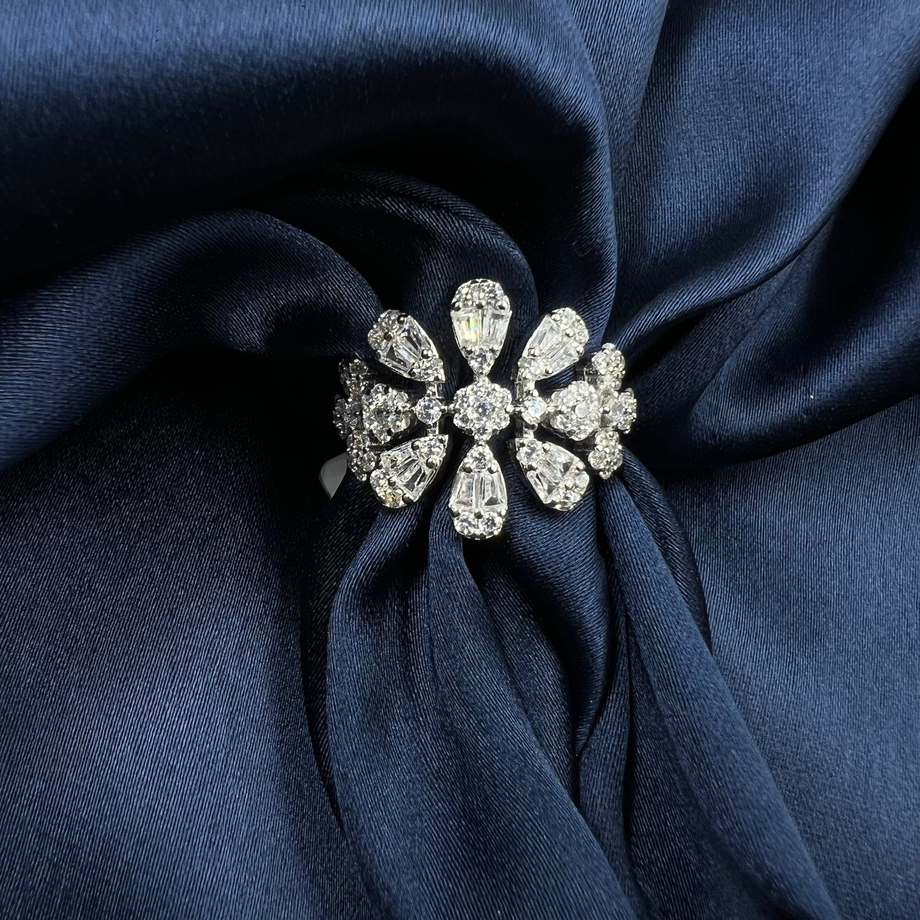 Silver brooch with clear stones