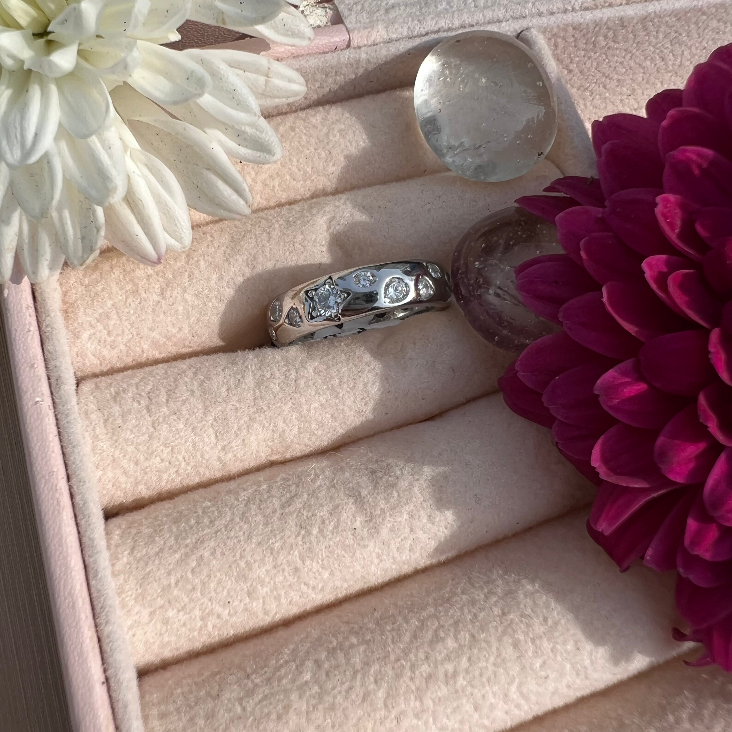 Silver ring with artificial diamonds design