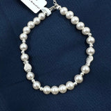 Pearl bracelet with silver Fish accents 