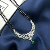 mangalsutra chain with silver cz pendant and green stone drop.