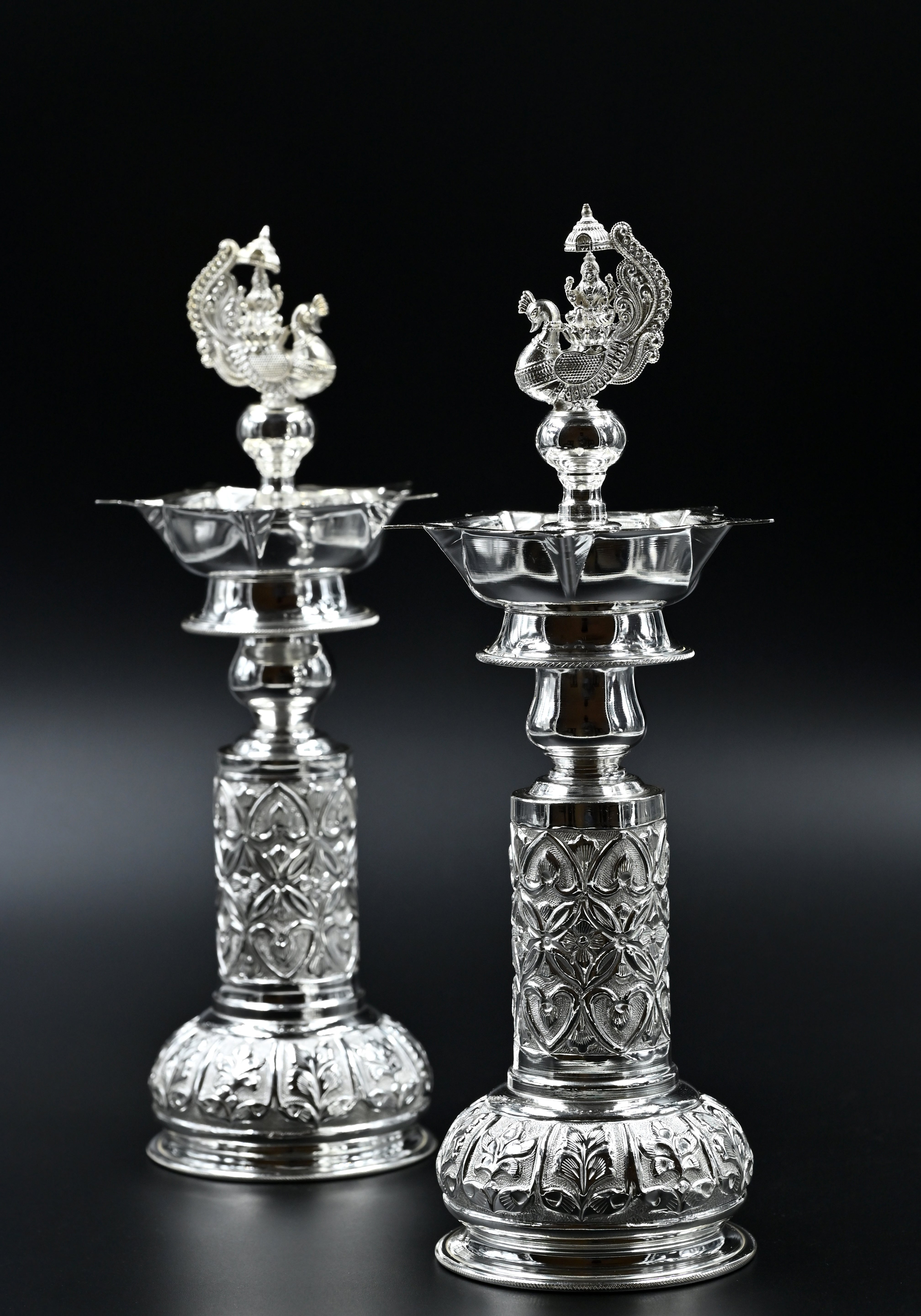 Silver peacock candle holder pair